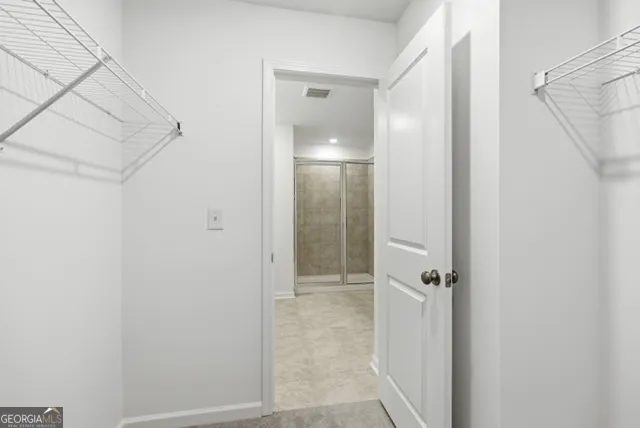 a view of a bathroom from a hallway