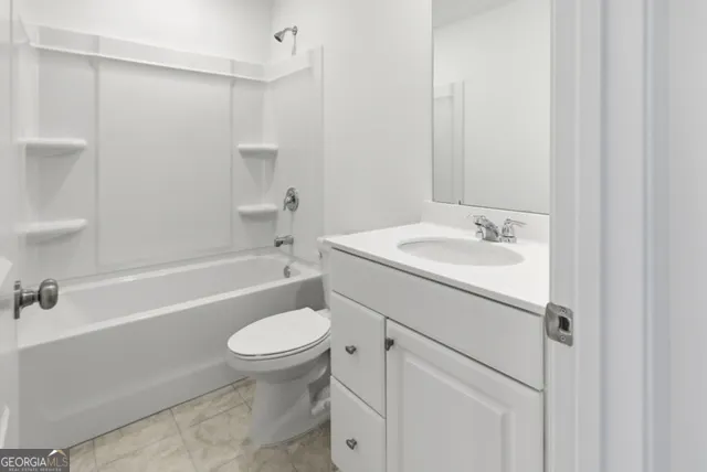 a bathroom with a sink a toilet and a bathtub