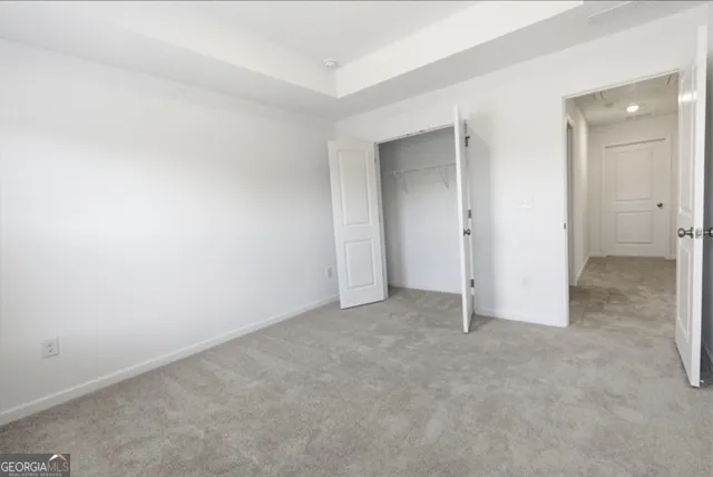 an empty room with a bathroom