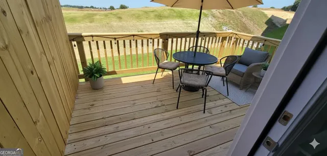 a view of a balcony with furniture