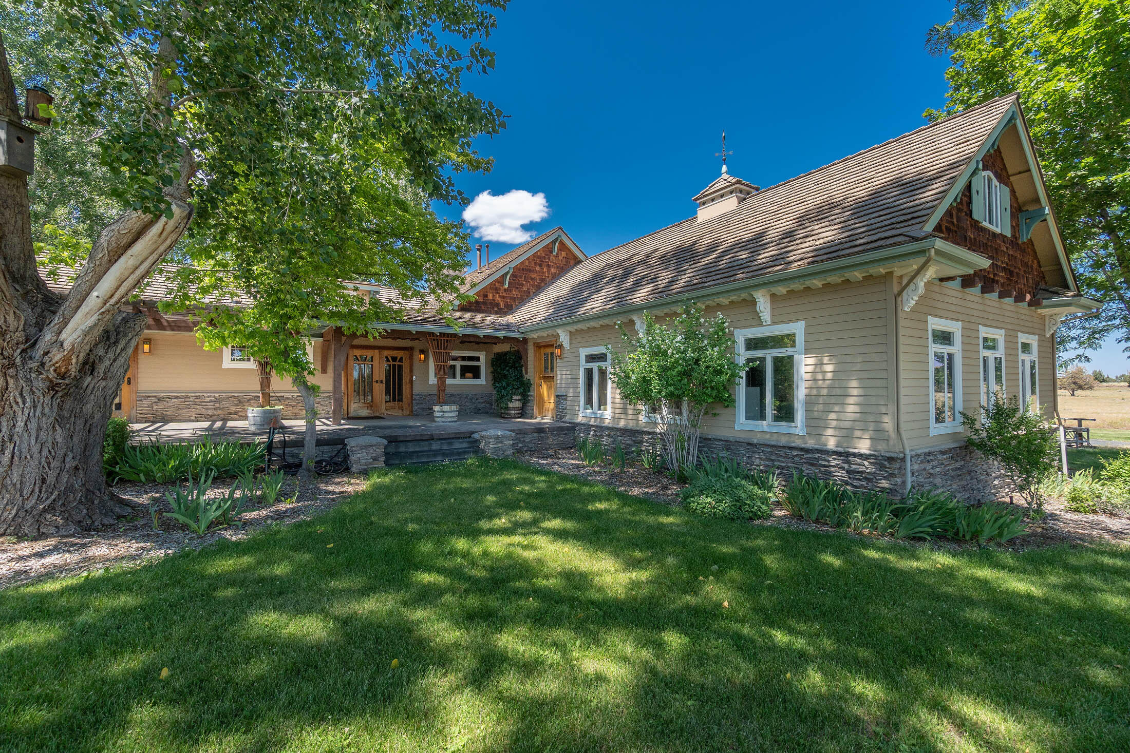 21925 Bear Creek Road Bend, OR 97702 - Photo 59 of 104 a view of a house with a backyard