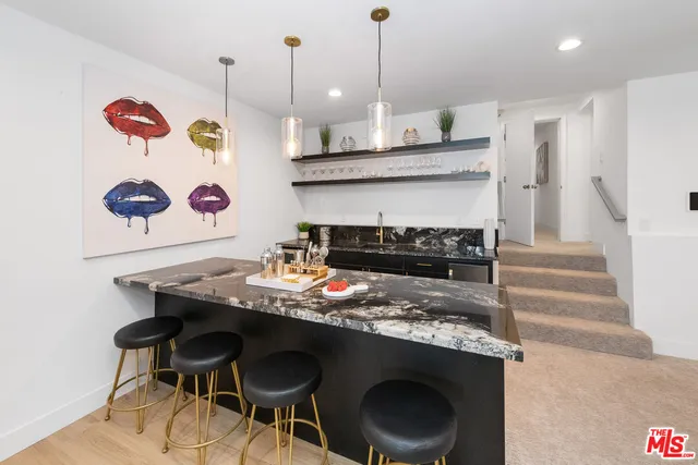 a table with a fireplace and a chandelier