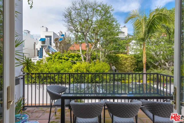 a view of a balcony with chairs