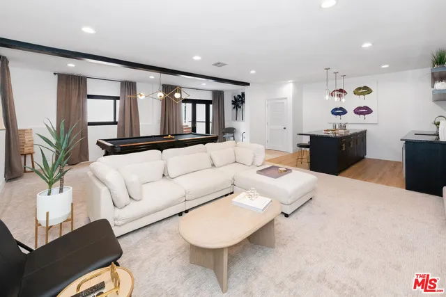 a living room with furniture and window