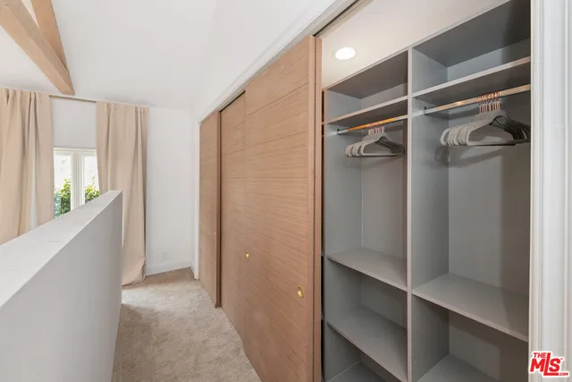 a view of walk in closet with window