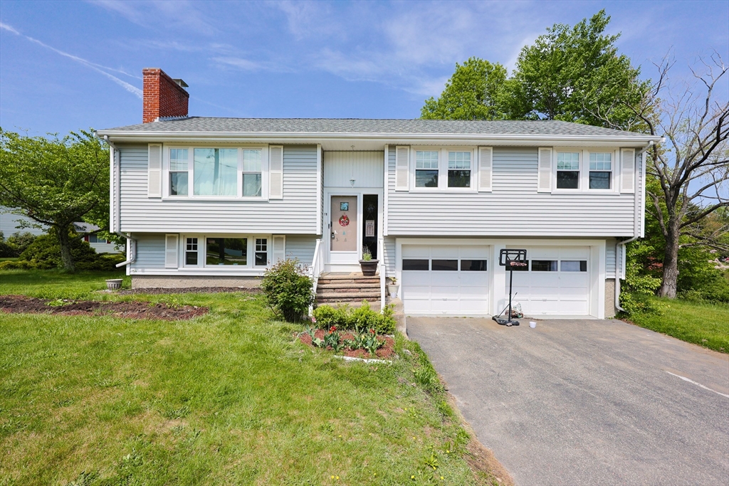 18 Tilden Road Canton, MA 02021 - Photo 1 of 30 a front view of a house with a yard and porch