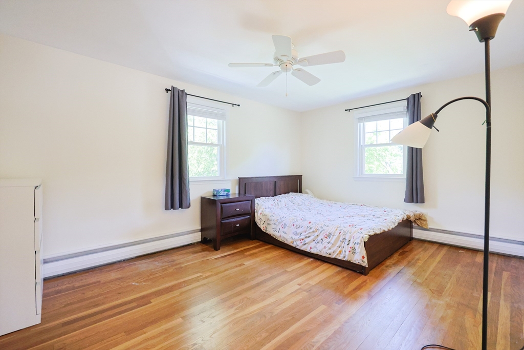 18 Tilden Road Canton, MA 02021 - Photo 14 of 30 a bedroom with a bed window and wooden floor