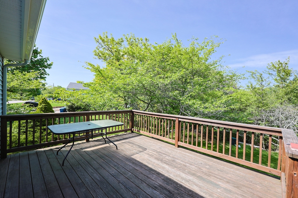 18 Tilden Road Canton, MA 02021 - Photo 21 of 30 a view of a balcony with wooden floor and outdoor seating