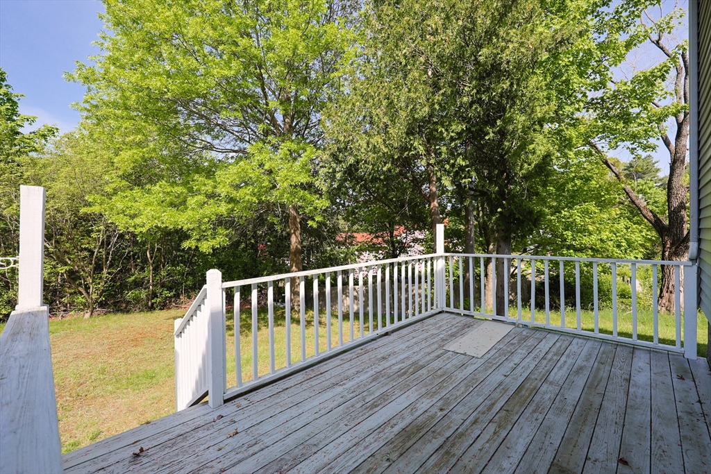 18 Tilden Road Canton, MA 02021 - Photo 22 of 30 a balcony with wooden floor and trees