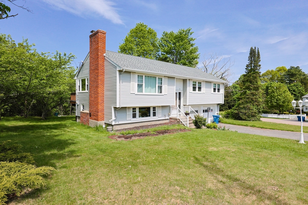 18 Tilden Road Canton, MA 02021 - Photo 23 of 30 a view of a house with a yard and sitting area