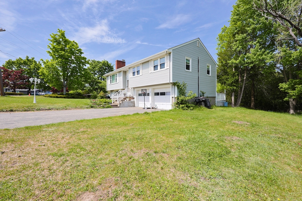 18 Tilden Road Canton, MA 02021 - Photo 25 of 30 a front view of a house with garden