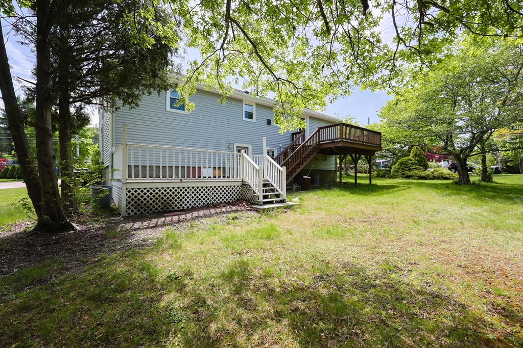 18 Tilden Road Canton, MA 02021 - Photo 27 of 30 a view of swimming pool with deck and a garden