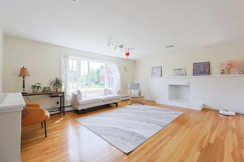 18 Tilden Road Canton, MA 02021 - Photo 3 of 30 a living room with furniture and a wooden floor