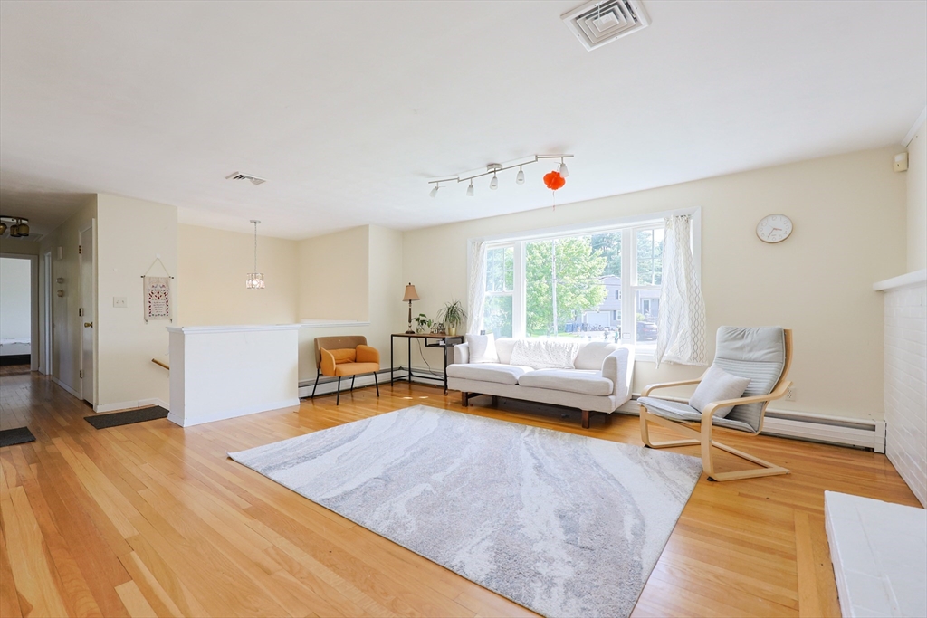 18 Tilden Road Canton, MA 02021 - Photo 4 of 30 a living room with furniture and a wooden floor