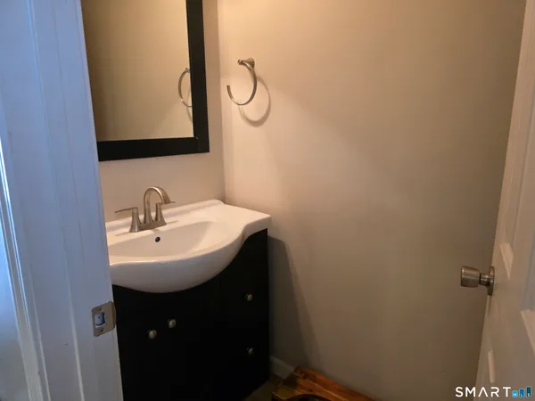 a bathroom with a sink and mirror