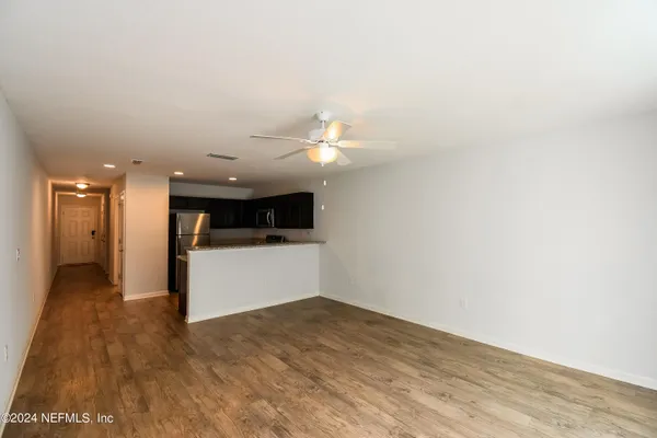 a view of a livingroom with a flat screen tv