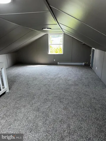 a view of a hallway with a window