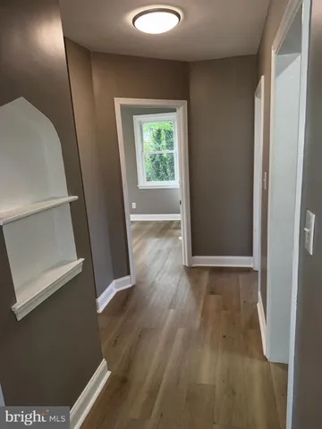 a view of entryway with wooden floor