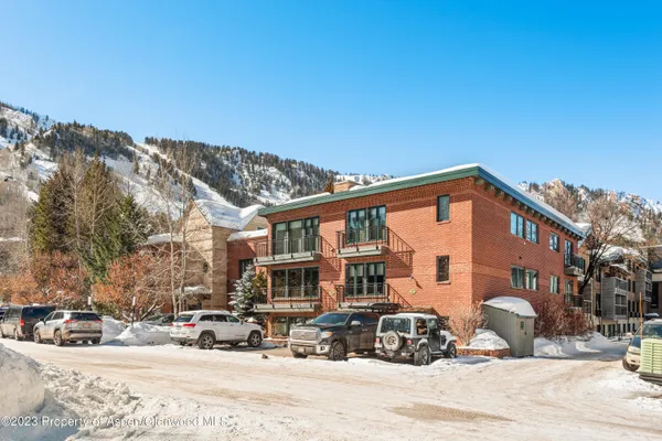 a street view with tall buildings and a street