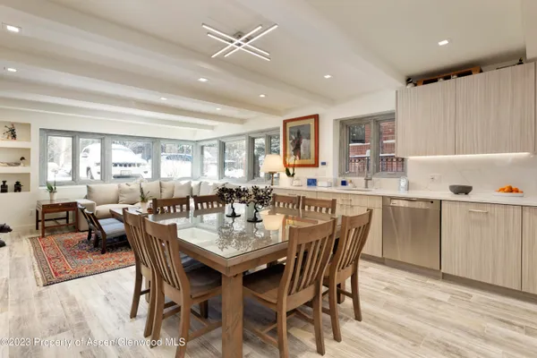 a dining room with furniture and window