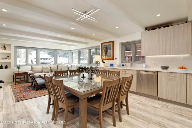 a dining room with furniture and window