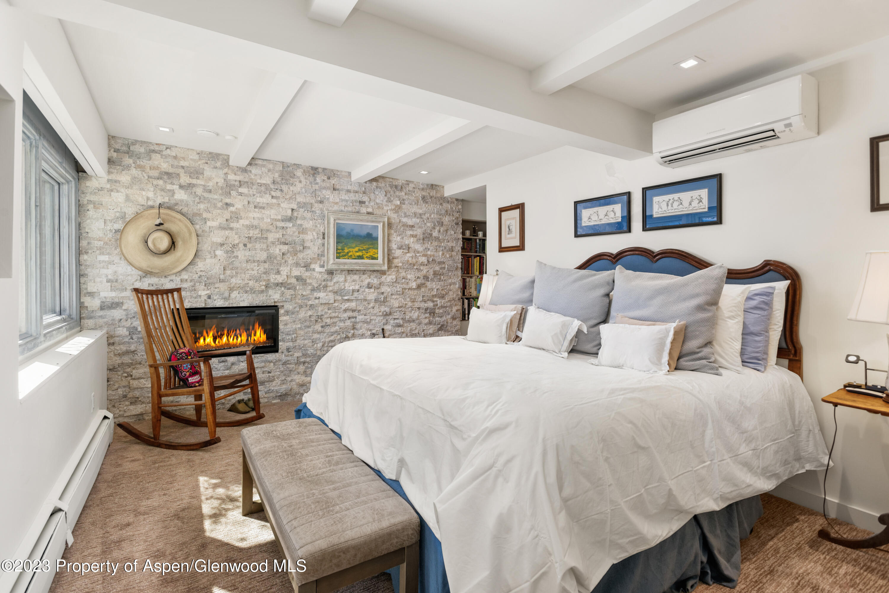 525 South Original Street, Unit B Aspen, CO 81611 - Photo 8 of 17 a bed room with a bed and a chair