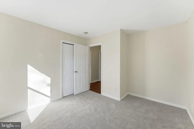 wooden floor in an empty room with a fireplace