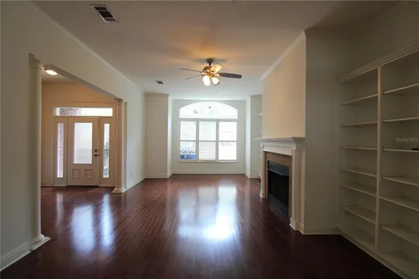a view of livingroom with hardwood floor and a ceiling fan
