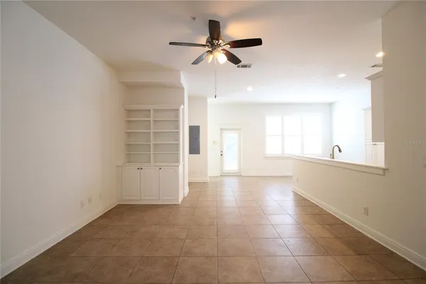 a view of an empty room with a window