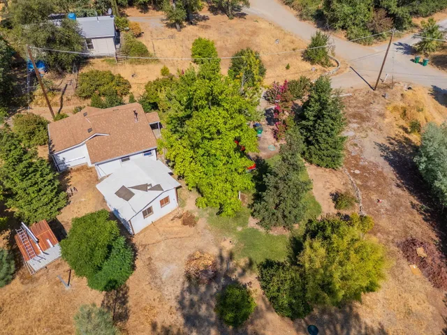 an aerial view of residential house with outdoor space