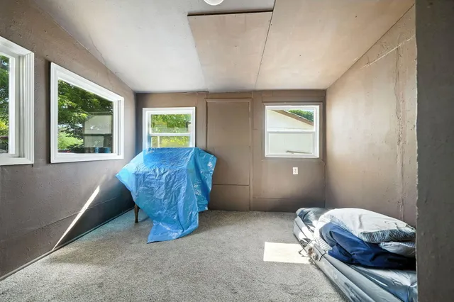 a living room with a couch and a window