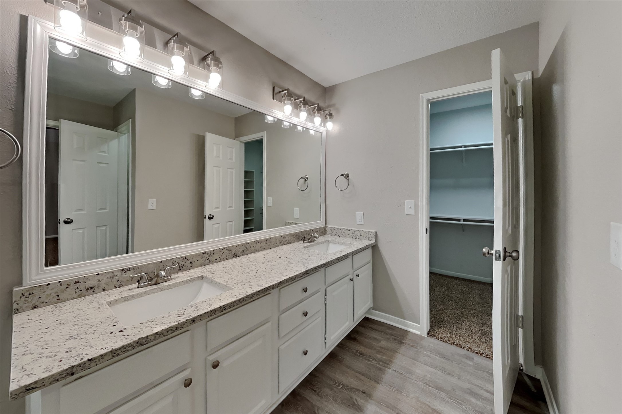 16303 Hickory Point Road Houston, TX 77095 - Photo 9 of 21 a spacious bathroom with a double vanity sink and a mirror