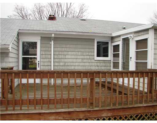 20 Newell Road Cranston, RI 02910 - Photo 3 of 20 Patio/Deck. Note that there are two doors from the home that open to the deck. The door on the right is from the four season room. The door to the left is from the breezeway entry.