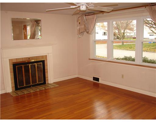 20 Newell Road Cranston, RI 02910 - Photo 4 of 20 Living Room. Fireplaced living room. All the windows in the home are new!