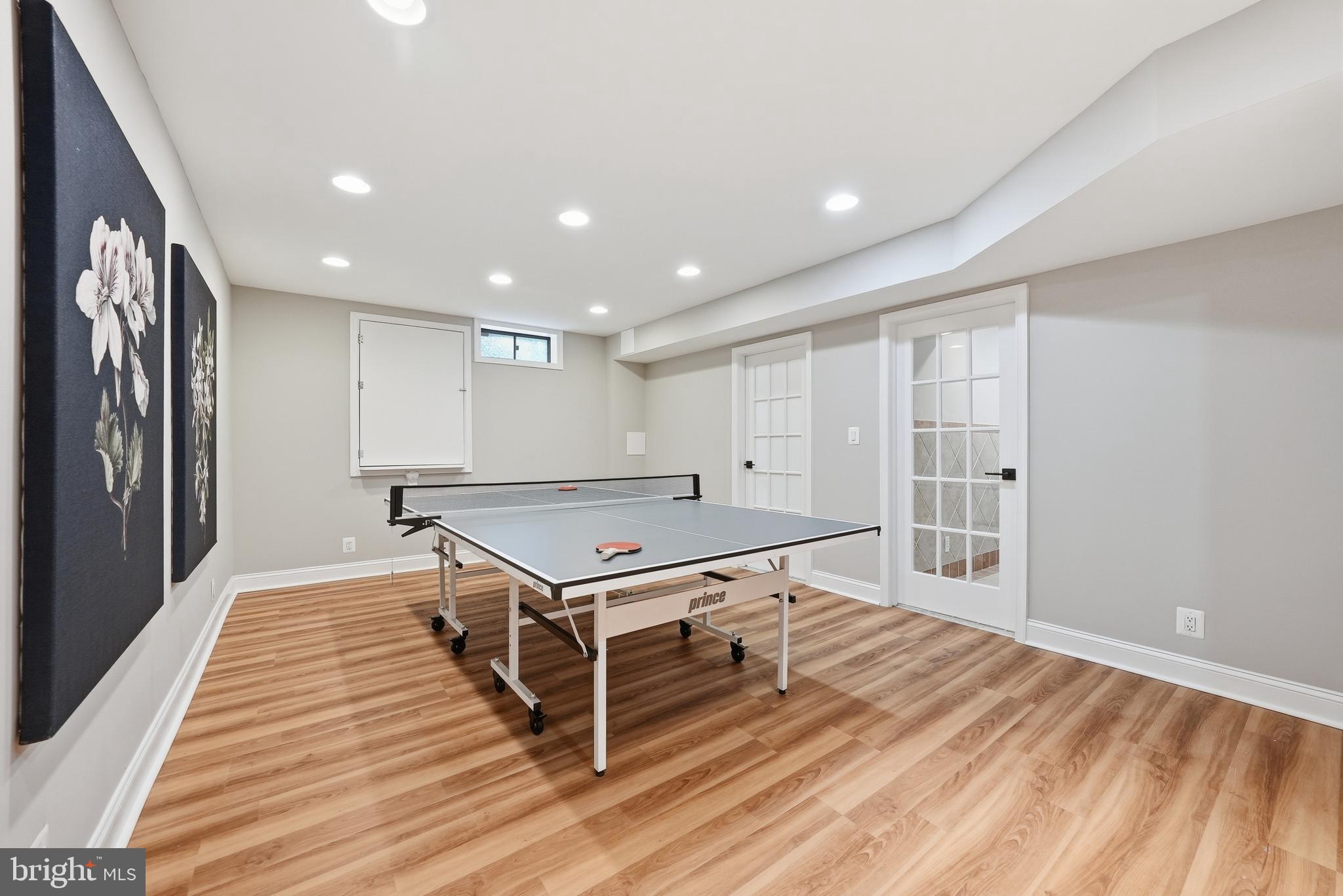 1291 Lamplighter Way Reston, VA 20194 - Photo 51 of 60 a living room with a table gym equipment and a wooden floor