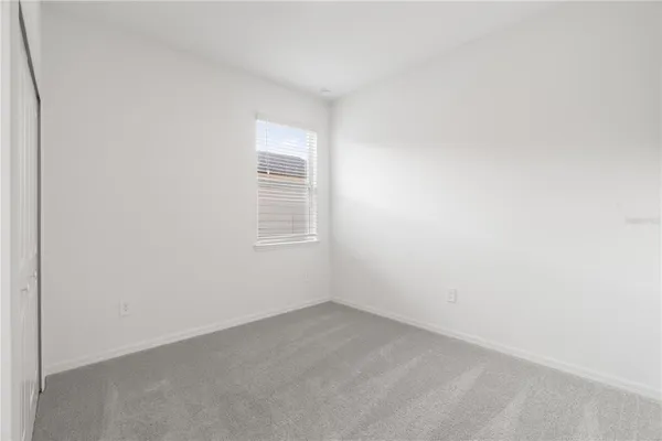 a bathroom with a granite countertop bathtub shower sink vanity and toilet