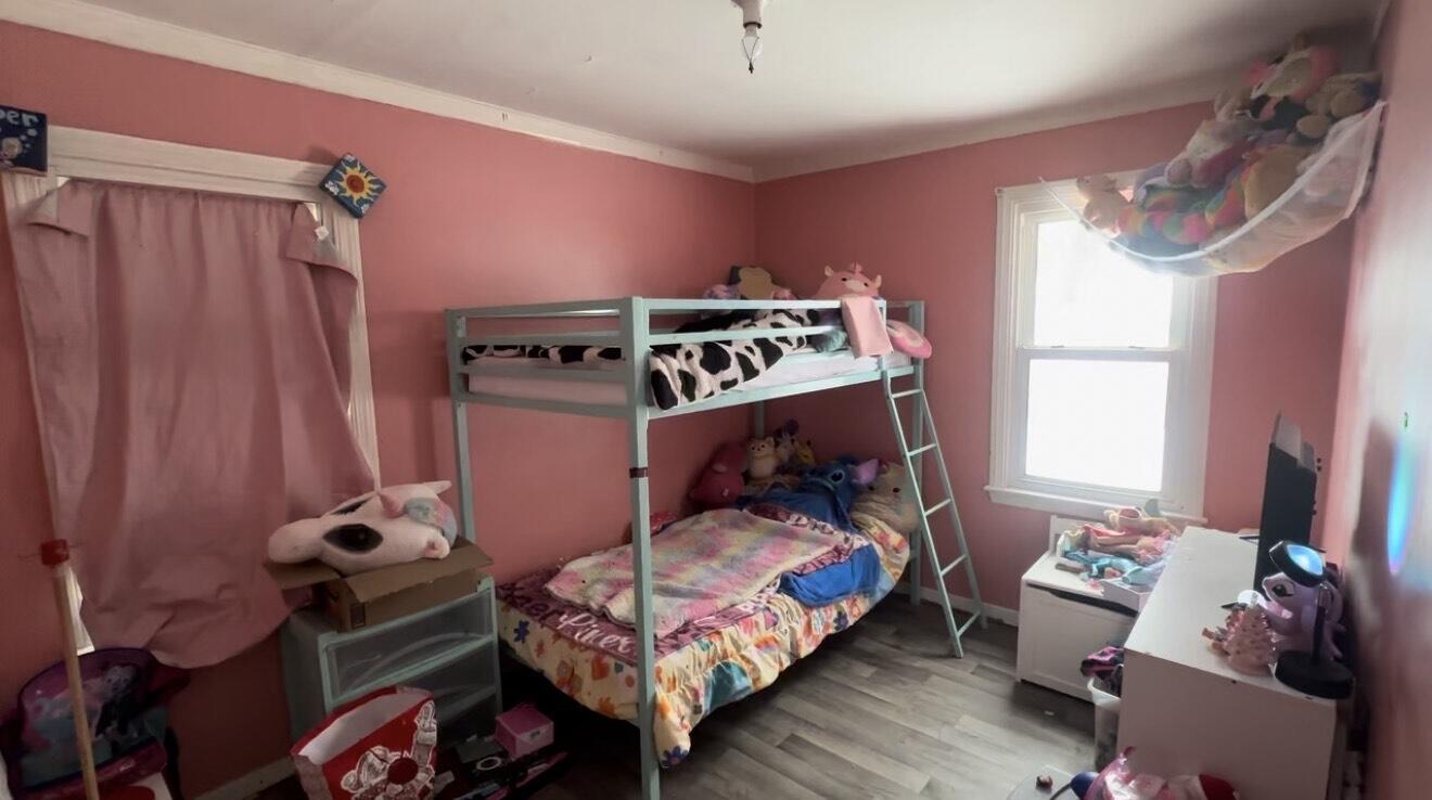 312 North Colorado Street Hobart, IN 46342 - Photo 5 of 8 a bedroom with a bed and a window