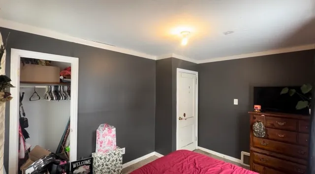 a bedroom with a bed and furniture