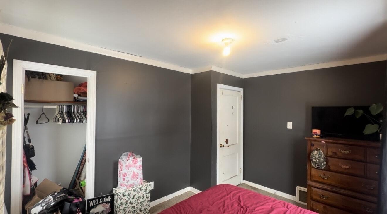 312 North Colorado Street Hobart, IN 46342 - Photo 6 of 8 a bedroom with a bed and furniture