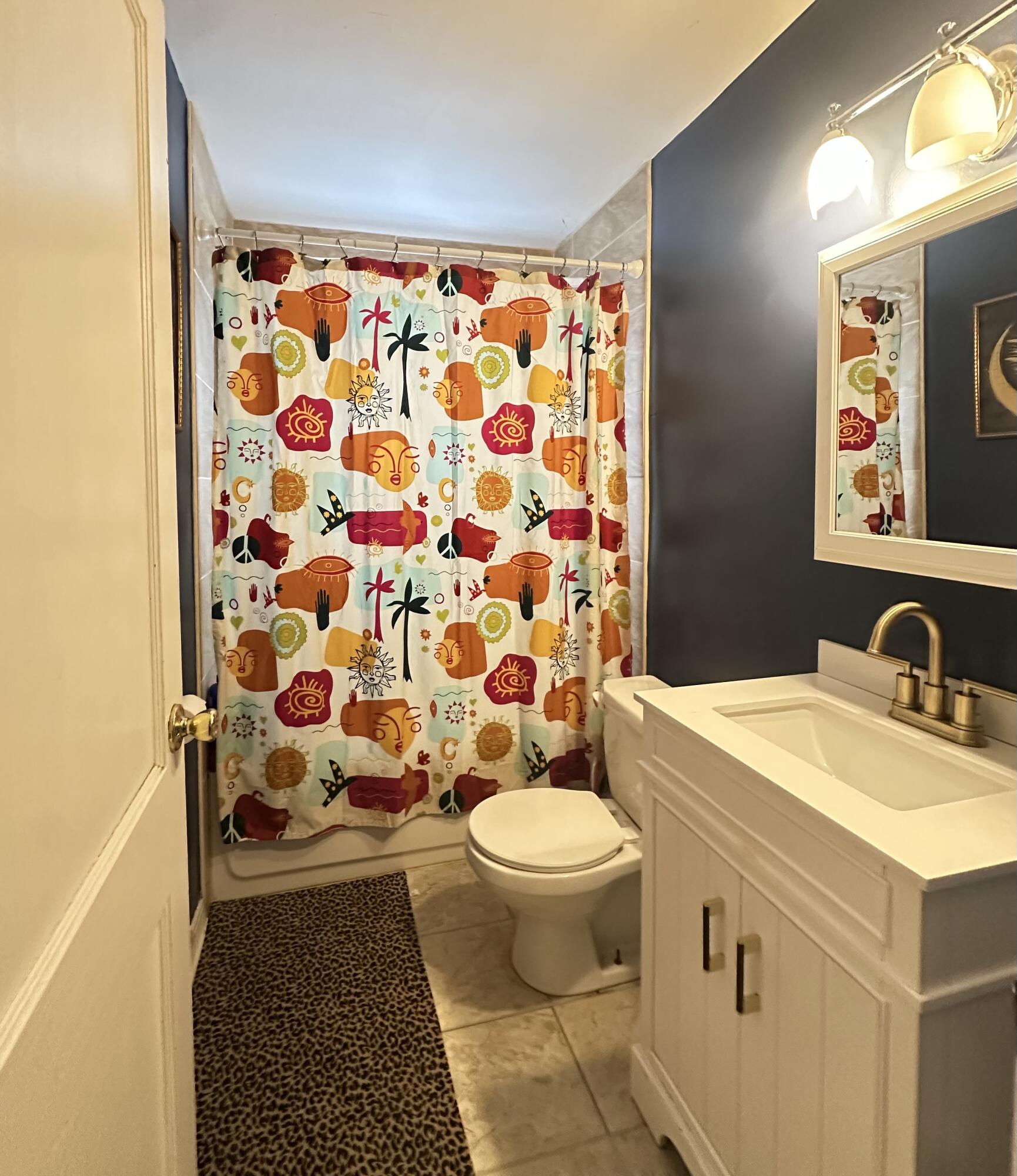 312 North Colorado Street Hobart, IN 46342 - Photo 7 of 8 a bathroom with a sink toilet and shower
