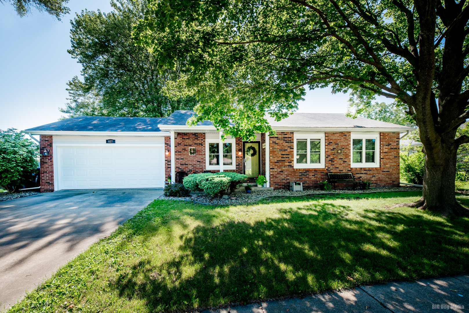 front view of a house with a yard