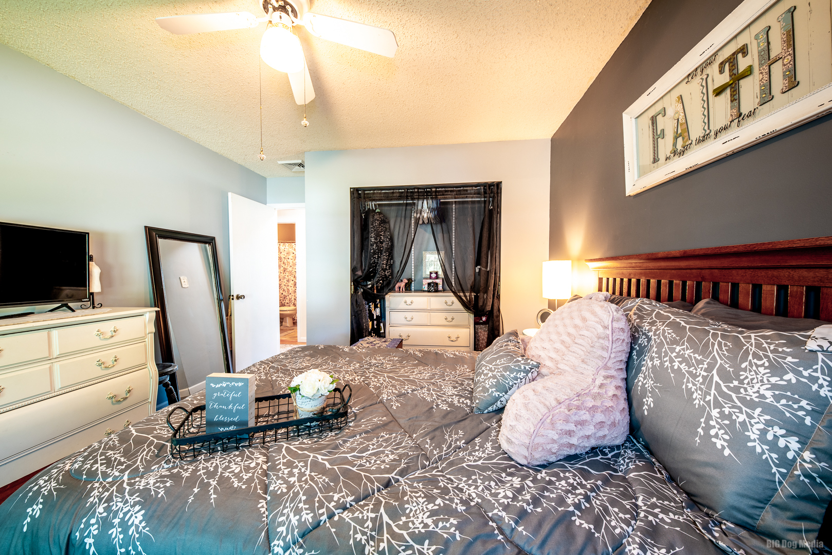 827 Independence Drive Bourbonnais, IL 60914 - Photo 16 of 25 a bedroom with a bed and flat screen tv