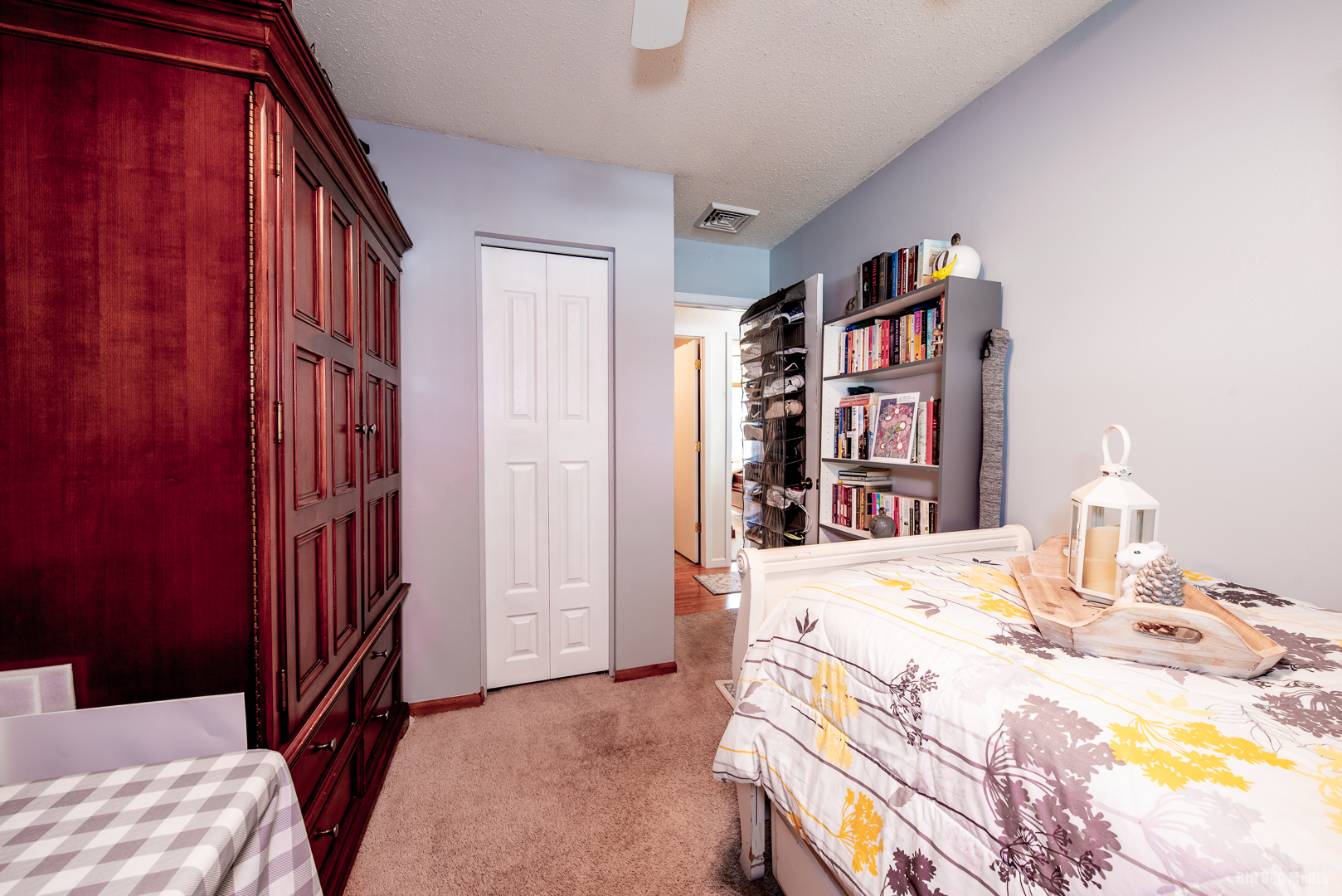827 Independence Drive Bourbonnais, IL 60914 - Photo 19 of 25 a bedroom with a bed and a book shelf