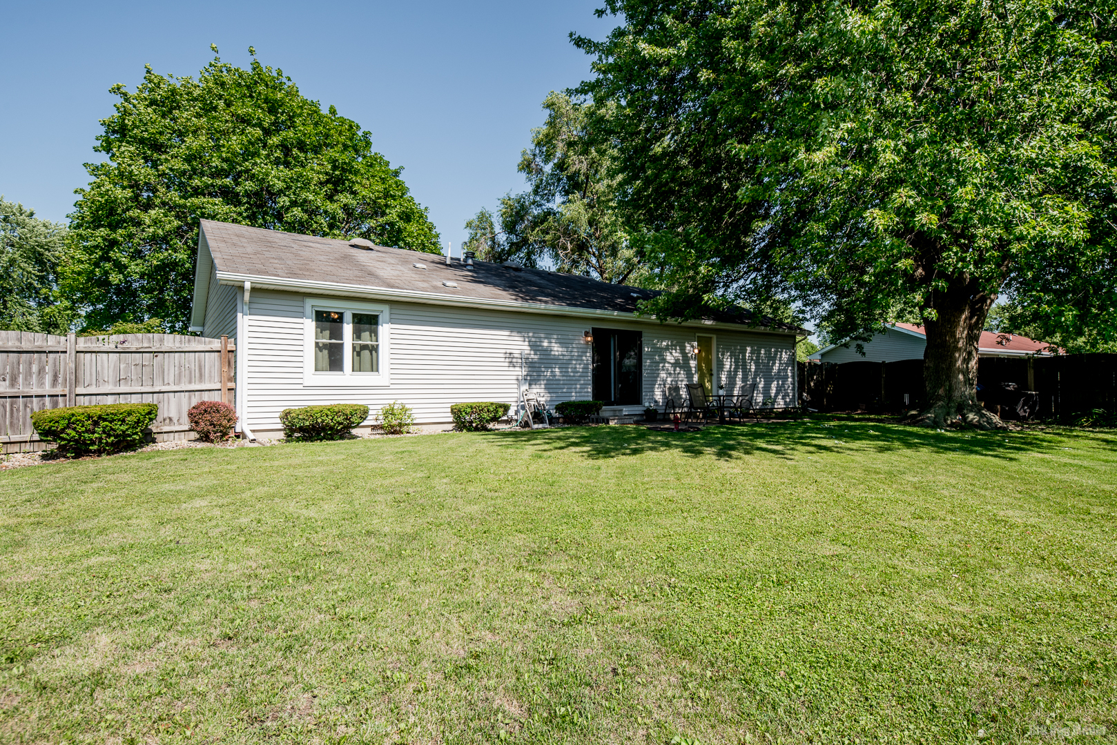 827 Independence Drive Bourbonnais, IL 60914 - Photo 22 of 25 a front view of a house with a yard and trees