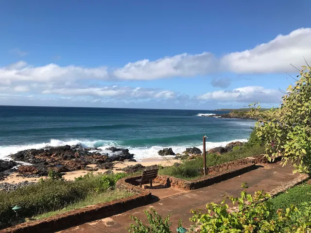 a view of a swimming pool with a table and chairs