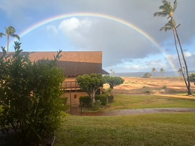 a balcony view with a seating space