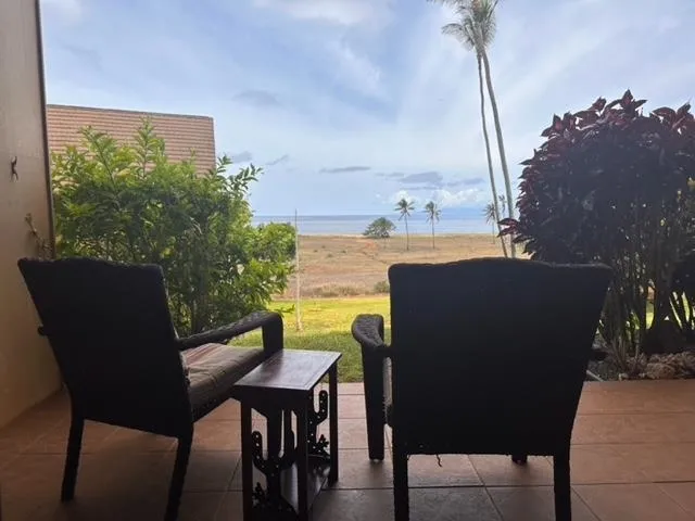 a outdoor sitting area with furniture and city view