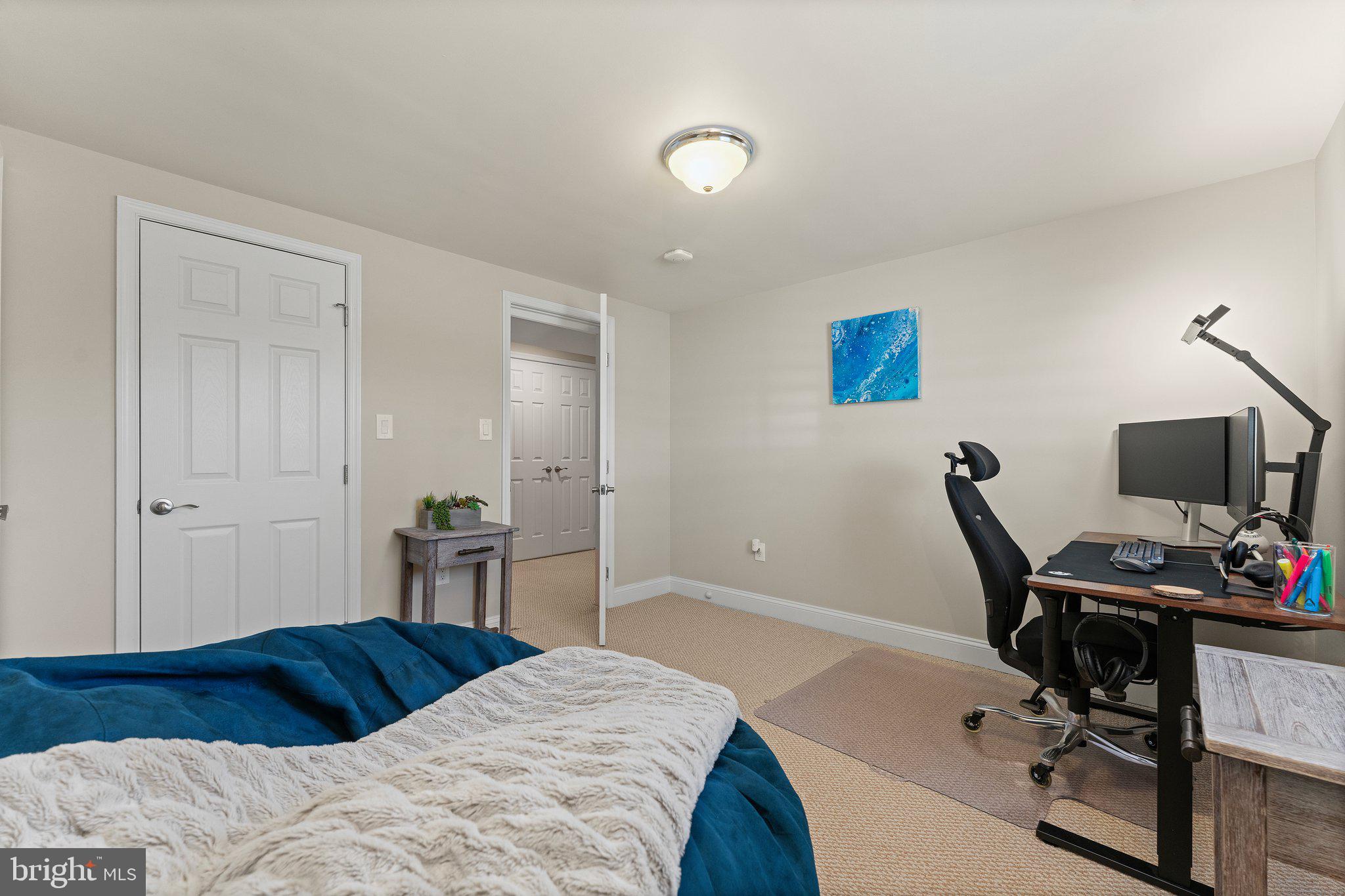 6408 Zekan Lane Springfield, VA 22150 - Photo 46 of 72 a bedroom with a bed and a chair