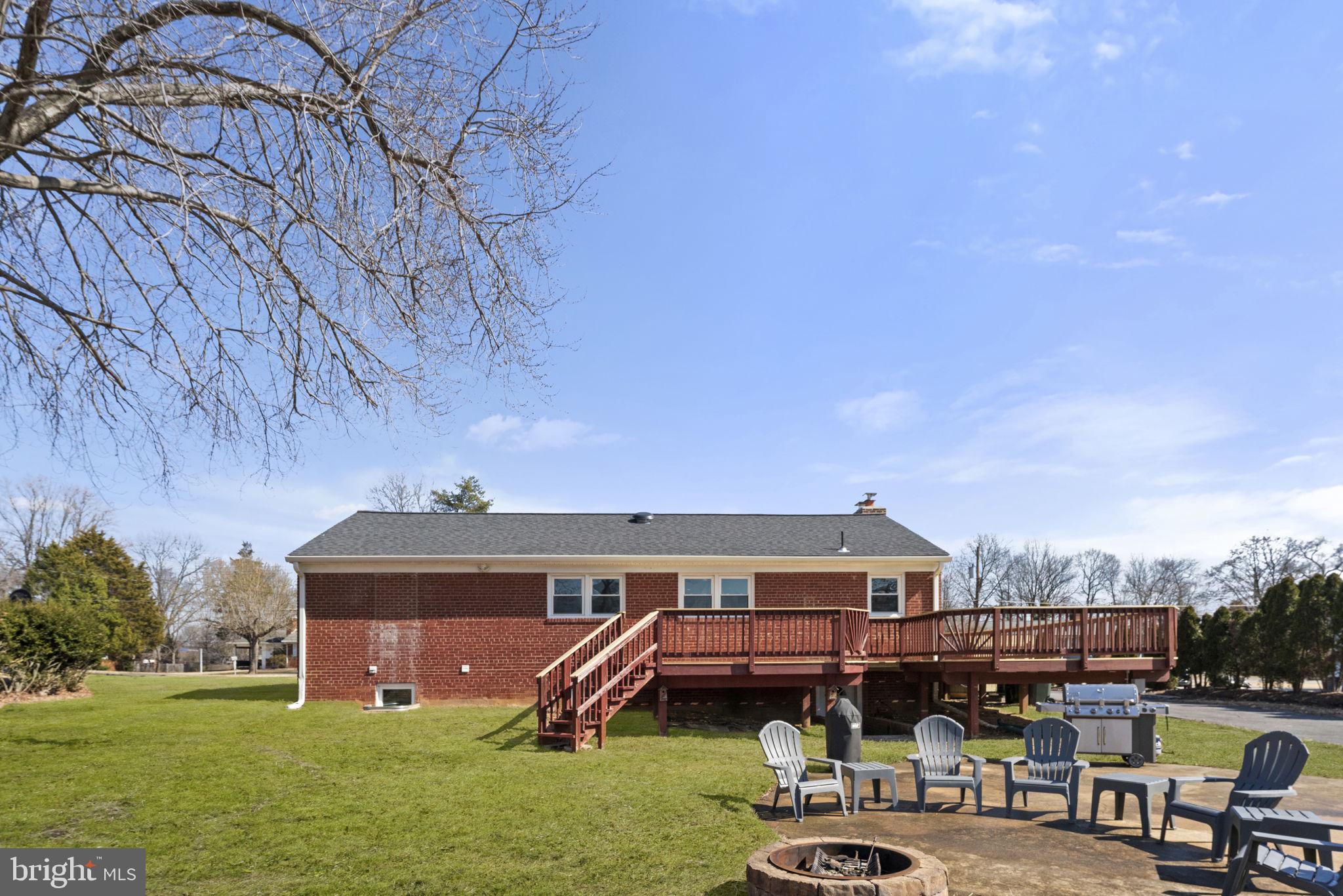 6408 Zekan Lane Springfield, VA 22150 - Photo 5 of 72 a front view of a house with garden