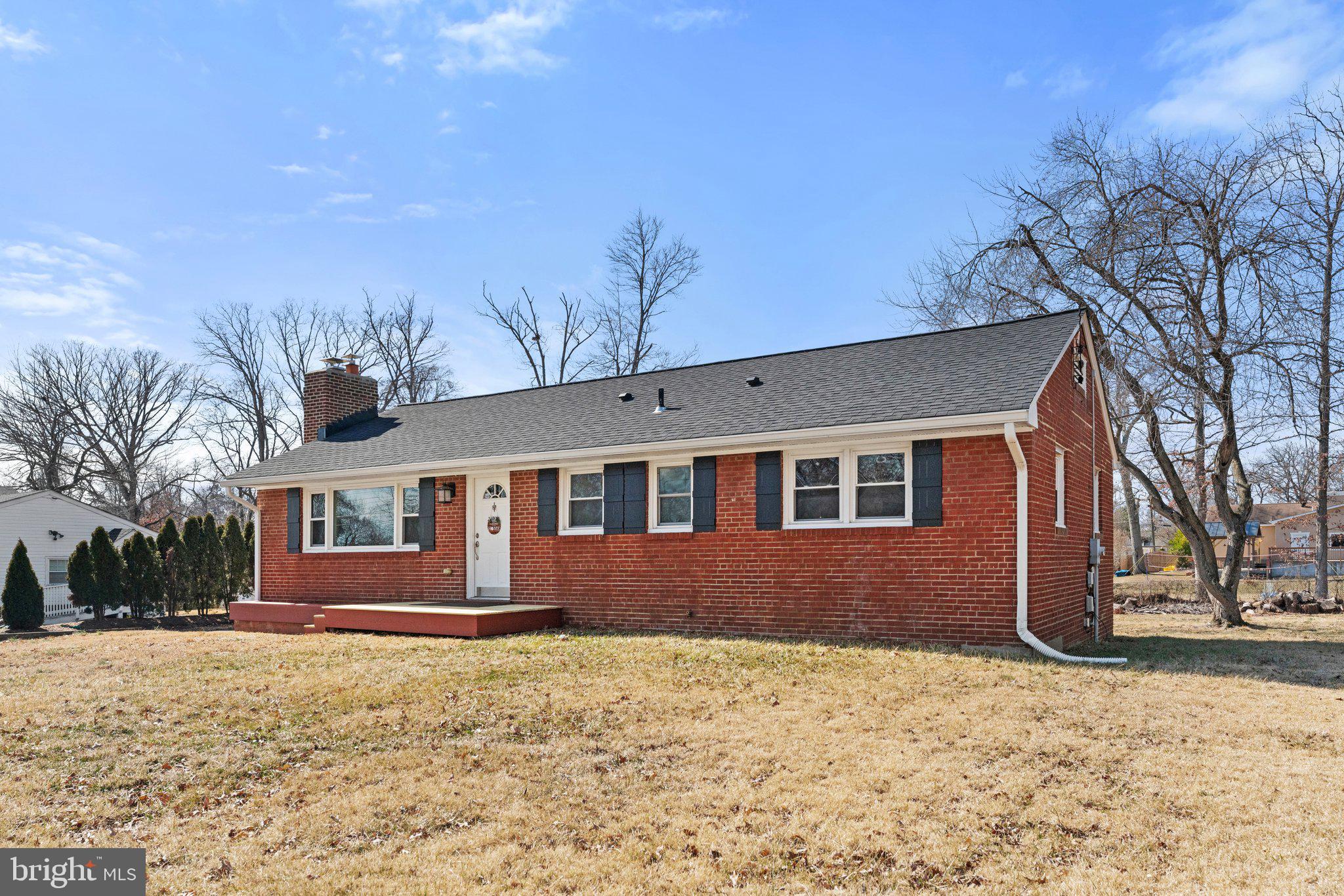 6408 Zekan Lane Springfield, VA 22150 - Photo 63 of 72 a front view of a house with a yard covered in snow